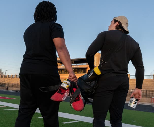 Two athletes on a football field