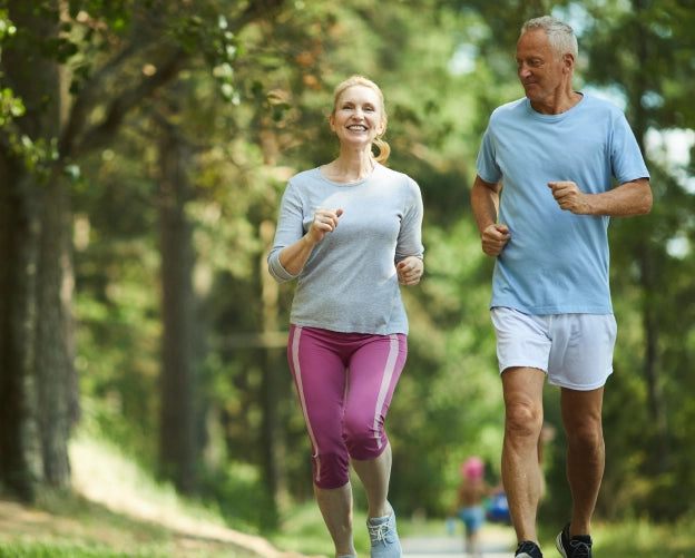 Happy elderly couple jogging