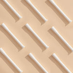 Applicators laid out on a tan background in a checkerboard pattern.
